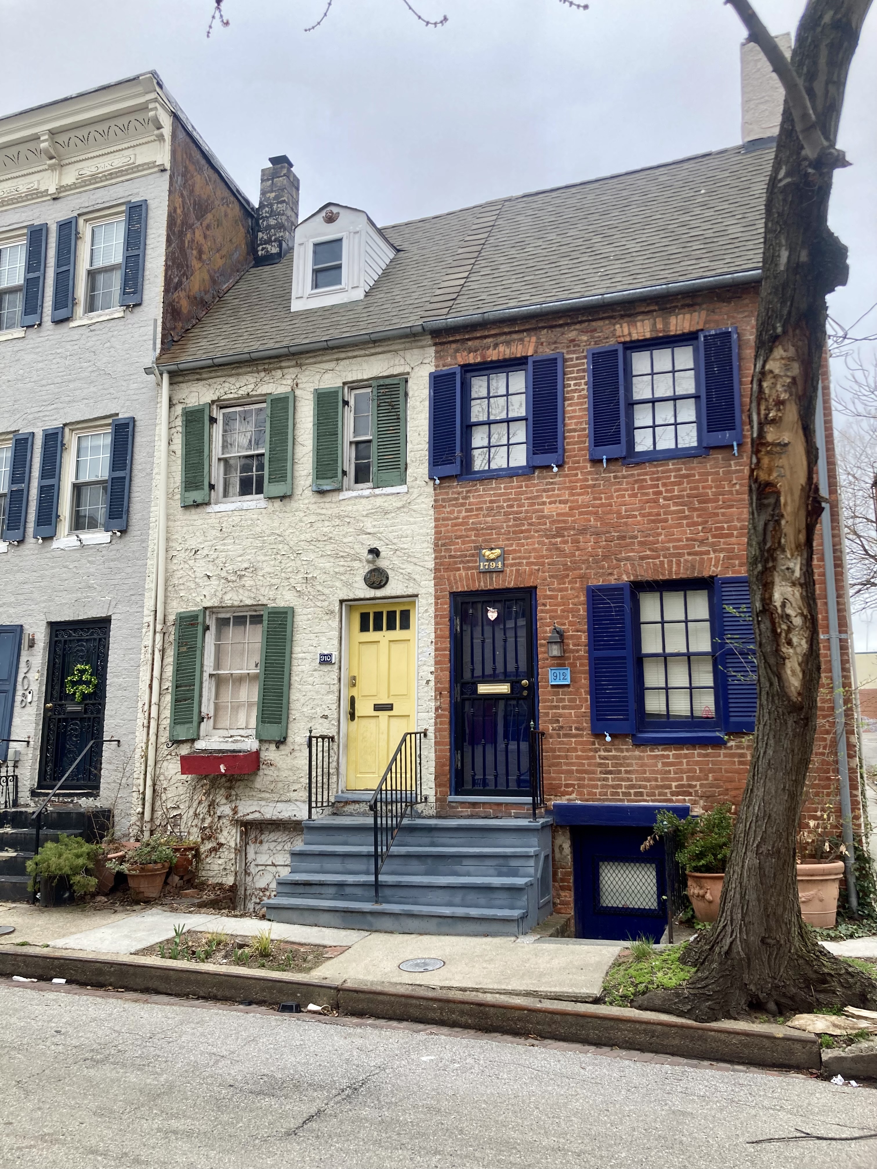 A white and glass conservatory with a blue sky above