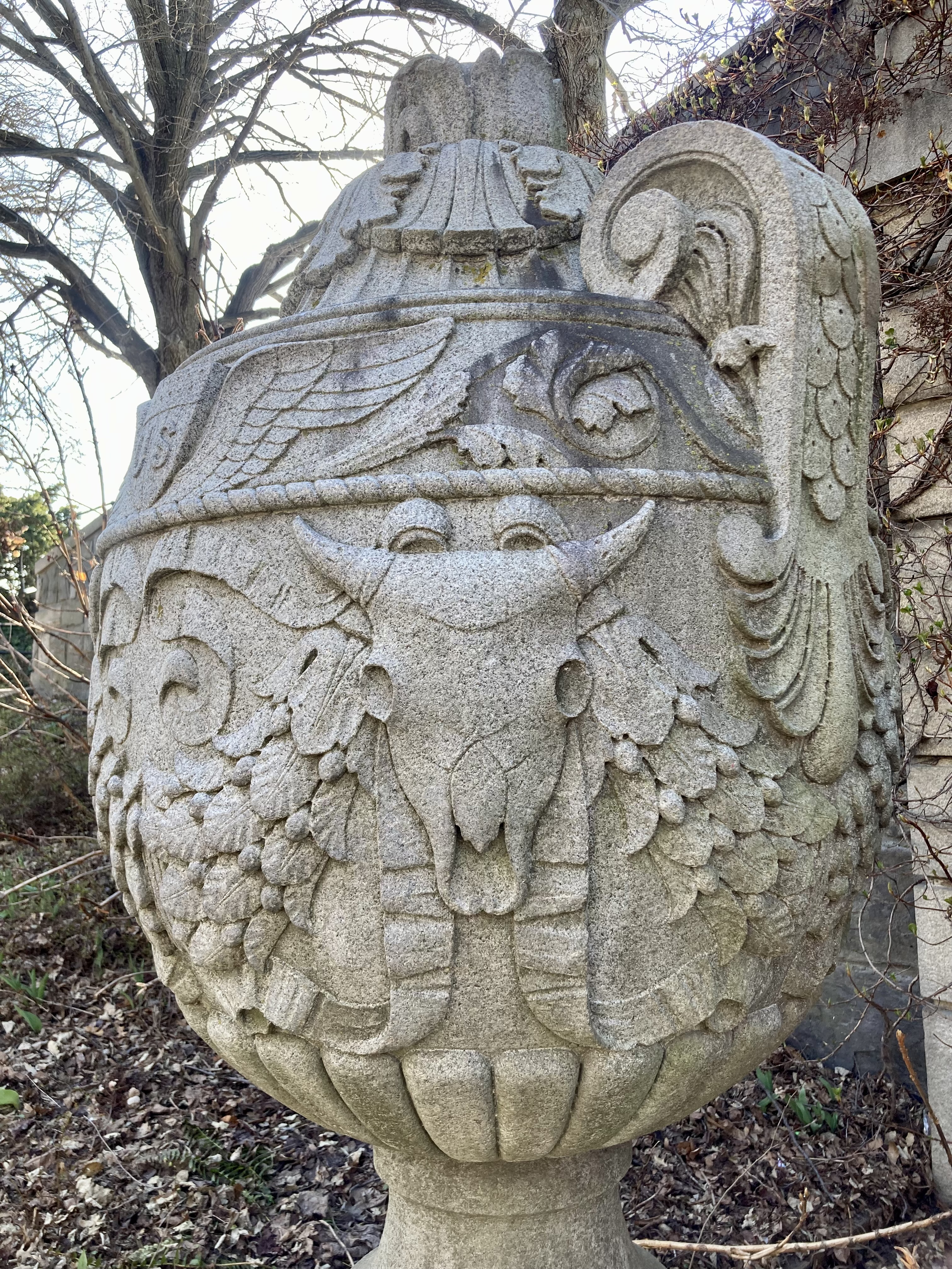 a carving of a skull on an urn