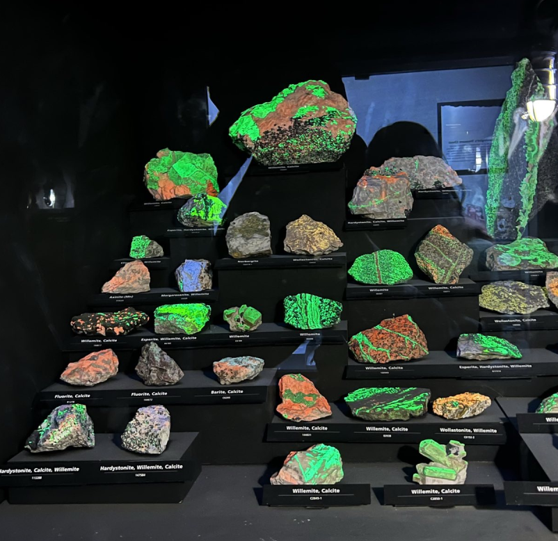 a campfire with a mandolin and folding chairs